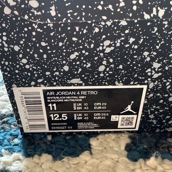 Air Jordan 4 Retro White and Black Sneakers